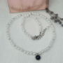 Colier handmade „Black Elegance” cu perle albe și pandantiv din piatra soarelui